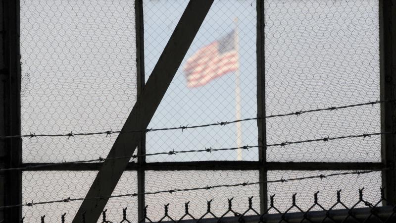 An NPR investigation finds that the military court and prison at Guantánamo Bay, Cuba, have cost taxpayers billions of dollars, with billions more expected. (Above) An American flag is seen through the war crimes courtroom at the U.S. naval base at Guant An NPR investigation finds that the military court and prison at Guantánamo Bay, Cuba, have cost taxpayers billions of dollars, with billions more expected. (Above) An American flag is seen through the war crimes courtroom at the U.S. naval base at Guant