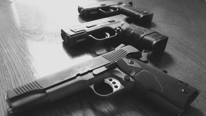 Three handguns. Three handguns.
