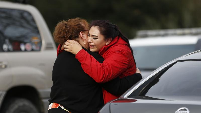 Vanessa Flores (right) embraces another woman Friday after she leaves the locked-down Veterans Home of California in Yountville, Calif., during a hostage situation. Law enforcement officers found a gunman and three hostages dead after a lengthy standoff. Vanessa Flores (right) embraces another woman Friday after she leaves the locked-down Veterans Home of California in Yountville, Calif., during a hostage situation. Law enforcement officers found a gunman and three hostages dead after a lengthy standoff.