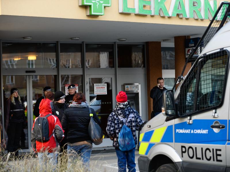 Police officers guard the doors of a teaching hospital in Ostrava, Czech Republic, after a gunman carried out a mass shooting in its waiting room Tuesday morning. Police officers guard the doors of a teaching hospital in Ostrava, Czech Republic, after a gunman carried out a mass shooting in its waiting room Tuesday morning.
