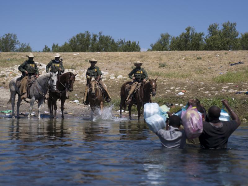 U.S. Border Patrol agents on horseback block migrants crossing the Rio Grande on Sunday near the Del Rio-Acuña Port of Entry in Texas. Horse patrols at that part of the border have been suspended, the White House press secretary says. U.S. Border Patrol agents on horseback block migrants crossing the Rio Grande on Sunday near the Del Rio-Acuña Port of Entry in Texas. Horse patrols at that part of the border have been suspended, the White House press secretary says.