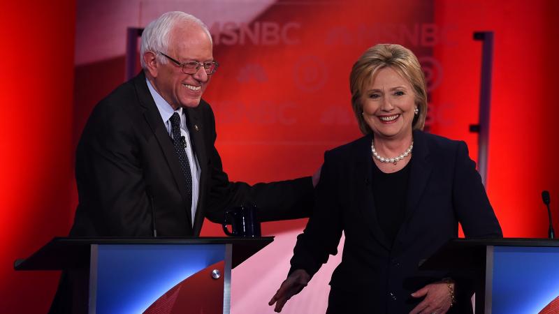 US Democratic presidential candidates Hillary Clinton (R) and Bernie Sanders smile after participating in the MSNBC Democratic Candidates Debate at the University of New Hampshire in Durham on February 4, 2016. US Democratic presidential candidates Hillary Clinton (R) and Bernie Sanders smile after participating in the MSNBC Democratic Candidates Debate at the University of New Hampshire in Durham on February 4, 2016.