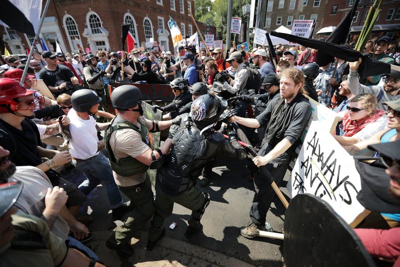 White nationalists, neo-Nazis and members of the "alt-right" clash with counter-protesters as they enter Emancipation Park during the "Unite the Right" rally August 12, 2017 in Charlottesville, Virginia. White nationalists, neo-Nazis and members of the "alt-right" clash with counter-protesters as they enter Emancipation Park during the "Unite the Right" rally August 12, 2017 in Charlottesville, Virginia.