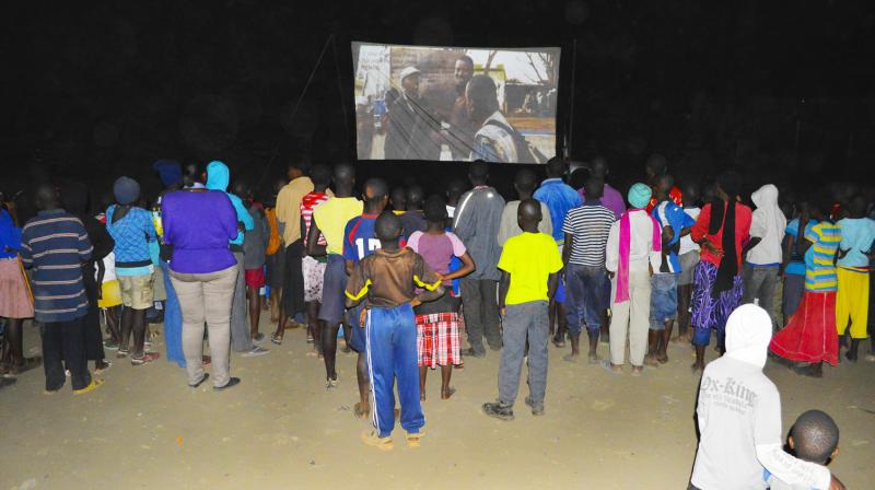 Movie lovers in Nairobi gather for a nighttime screening at last year's Slum Film Festival. Movie lovers in Nairobi gather for a nighttime screening at last year's Slum Film Festival.