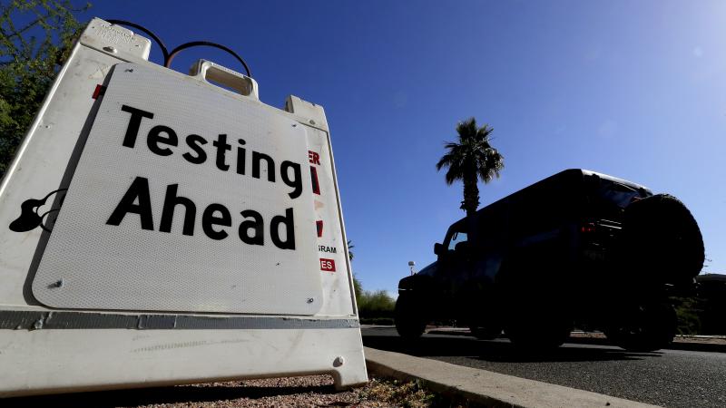 A vehicle arrives at COVID-19 testing site at Steele Indian School Park on May 23 in Phoenix. Arizona has seen a rush of new coronavirus cases recently. A vehicle arrives at COVID-19 testing site at Steele Indian School Park on May 23 in Phoenix. Arizona has seen a rush of new coronavirus cases recently.