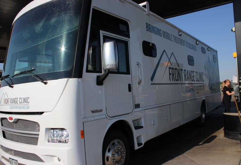 Each mobile clinic has a nurse, a counselor and a peer specialist — all trained to drive a 34-foot-long motor home. "I never thought when I went to nursing school that I'd be doing this," says Christi Couron as she pumps 52 gallons of diesel fuel into t Each mobile clinic has a nurse, a counselor and a peer specialist — all trained to drive a 34-foot-long motor home. "I never thought when I went to nursing school that I'd be doing this," says Christi Couron as she pumps 52 gallons of diesel fuel into t