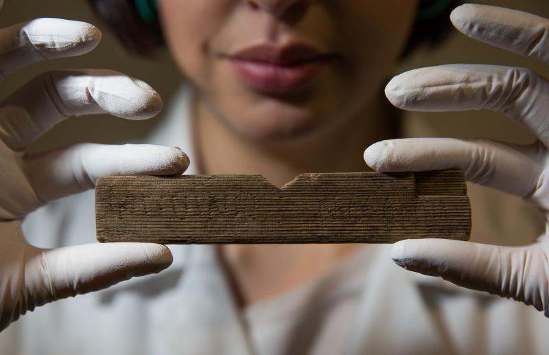 Archaeological conservator Luisa Duarte holds a Roman waxed writing tablet at Bloomberg's London offices on Wednesday. This tablet contains the earliest written reference to London, dated A.D. 65-80; it reads "Londinio Mogontio" -- that is, "in London Archaeological conservator Luisa Duarte holds a Roman waxed writing tablet at Bloomberg's London offices on Wednesday. This tablet contains the earliest written reference to London, dated A.D. 65-80; it reads "Londinio Mogontio" -- that is, "in London