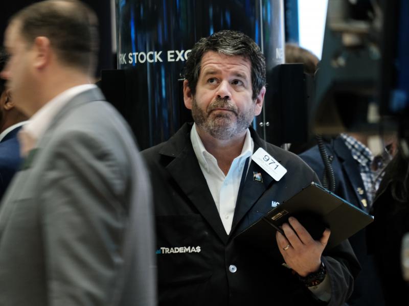 Traders work on the floor of the New York Stock Exchange (NYSE) in New York City on April 28. Stocks sank on Friday, ending a miserable month for Wall Street. Traders work on the floor of the New York Stock Exchange (NYSE) in New York City on April 28. Stocks sank on Friday, ending a miserable month for Wall Street.