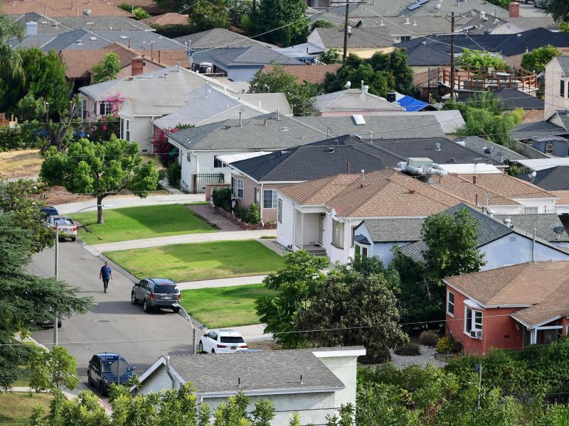 A man walks through a neighborhood of single-family homes in Los Angeles last week. The CDC announced a new temporary eviction ban a few days after the previous one expired. A man walks through a neighborhood of single-family homes in Los Angeles last week. The CDC announced a new temporary eviction ban a few days after the previous one expired.