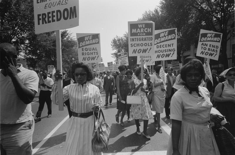 At the March on Washington on Aug. 28, 1963, African Americans carry placards demanding equal rights, integrated schools, decent housing and an end to bias. At the March on Washington on Aug. 28, 1963, African Americans carry placards demanding equal rights, integrated schools, decent housing and an end to bias.
