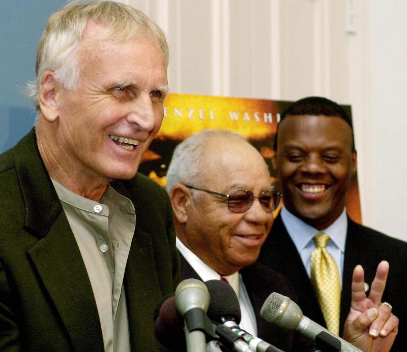 Former high school football coach Herman Boone, center, has died at age 84. He's seen here with his friend and colleague Bill Yoast, left — who died earlier this year — and former Rep. J.C. Watts, Jr. Former high school football coach Herman Boone, center, has died at age 84. He's seen here with his friend and colleague Bill Yoast, left — who died earlier this year — and former Rep. J.C. Watts, Jr.