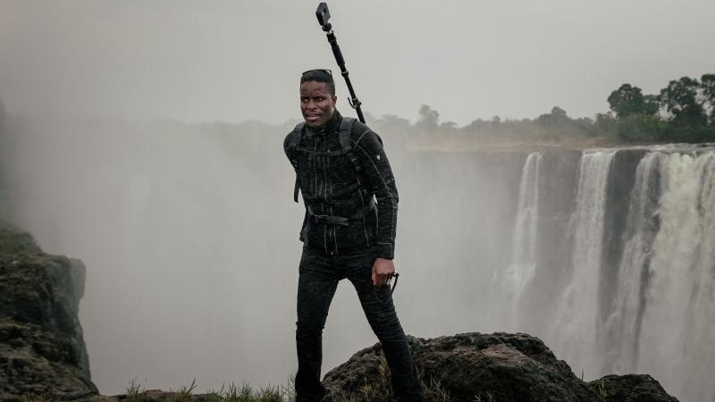 Tawanda Kanhema in 2018 wearing Google Street View camera gear at Victoria Falls in Zimbabwe. Tawanda Kanhema in 2018 wearing Google Street View camera gear at Victoria Falls in Zimbabwe.