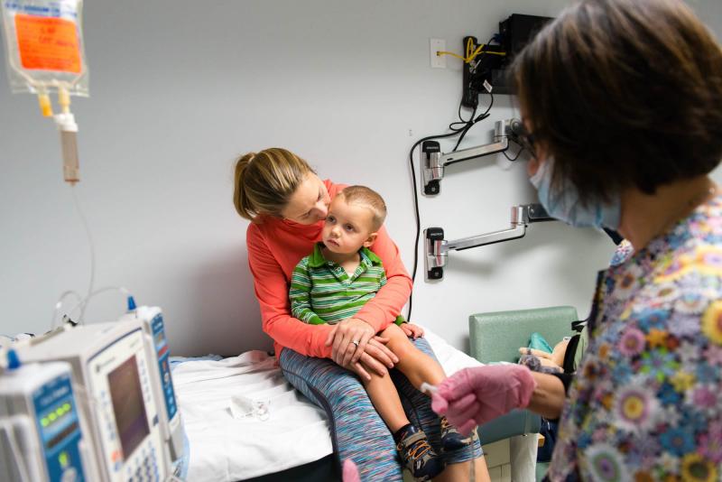 Luke Whitbeck, 2, sits on his mother's lap while the nurse prepares his treatment at a pediatric infusion center in Hawthorne, N.Y., in October 2016. Luke Whitbeck, 2, sits on his mother's lap while the nurse prepares his treatment at a pediatric infusion center in Hawthorne, N.Y., in October 2016.