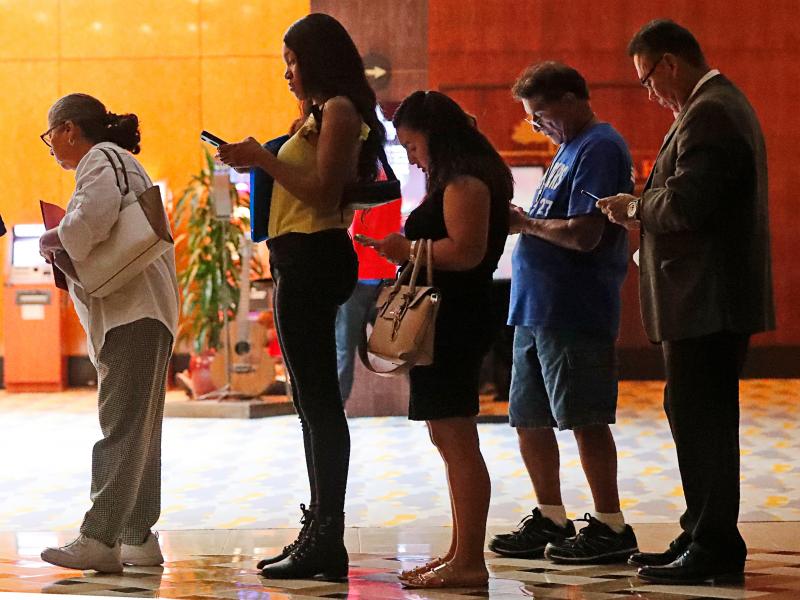 Job applicants wait in line at the Seminole Hard Rock Hotel & Casino Hollywood during a job fair in Hollywood, Fla., on Thursday. Job applicants wait in line at the Seminole Hard Rock Hotel & Casino Hollywood during a job fair in Hollywood, Fla., on Thursday.