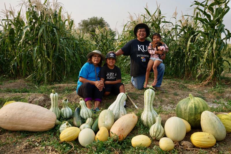 Native tribes have responded to the pandemic with creative ways to stay connected. Veronica Concho and Raymond Concho Jr. grew traditional Pueblo foods and Navajo crops with their grandchildren Kaleb and Kateri Allison-Burbank in Waterflow, N.M. Native tribes have responded to the pandemic with creative ways to stay connected. Veronica Concho and Raymond Concho Jr. grew traditional Pueblo foods and Navajo crops with their grandchildren Kaleb and Kateri Allison-Burbank in Waterflow, N.M.