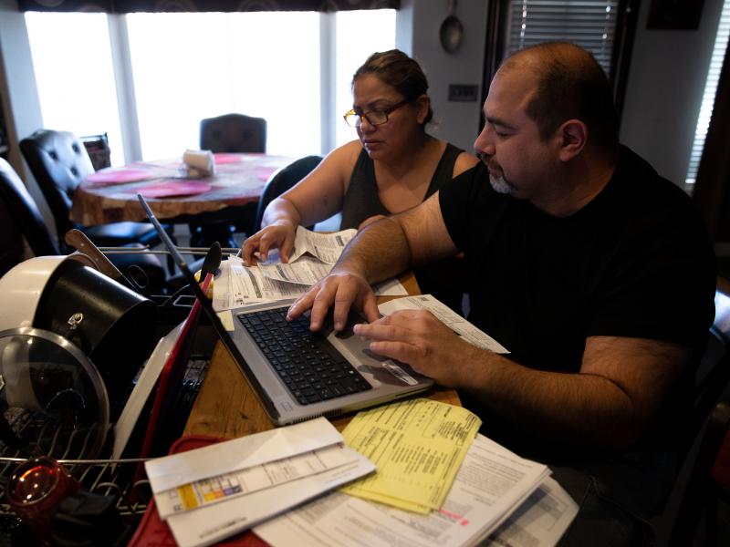 Claudia and Jesús Fierro of Yuma, Ariz., review their medical bills. They pay $1,000 a month for health insurance yet still owed more than $7,000 after two episodes of care at the local hospital. Claudia and Jesús Fierro of Yuma, Ariz., review their medical bills. They pay $1,000 a month for health insurance yet still owed more than $7,000 after two episodes of care at the local hospital.