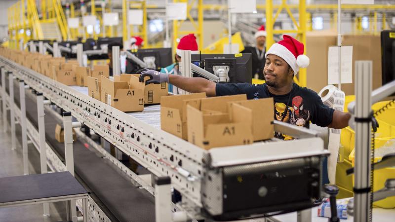 Workers pack items Sunday at an Amazon fulfillment center in Tracy, Calif. Cyber Monday online sales jumped 8.5 percent over 2013. Workers pack items Sunday at an Amazon fulfillment center in Tracy, Calif. Cyber Monday online sales jumped 8.5 percent over 2013.