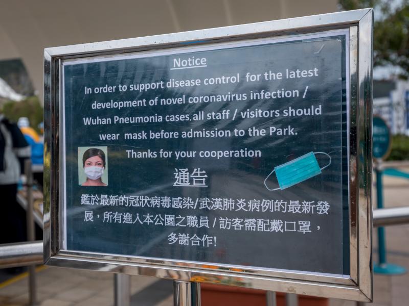 A notice advising all staff and visitors to wear protective masks stands outside the closed Ocean Park in Hong Kong, on Monday. A notice advising all staff and visitors to wear protective masks stands outside the closed Ocean Park in Hong Kong, on Monday.