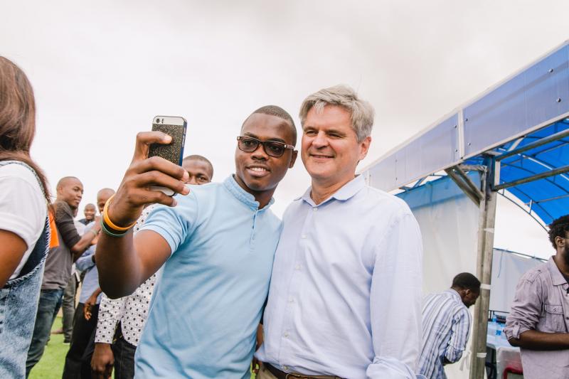 Babajide Bello of the tech company Andela takes a selfie with AOL's Steve Case after the pair played a pickup game of pingpong. Babajide Bello of the tech company Andela takes a selfie with AOL's Steve Case after the pair played a pickup game of pingpong.