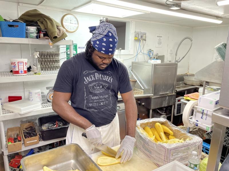 Jason Brissett, a kitchen worker who came to the U.S. last month from Jamaica through an H-2B visa, is bracing for 80-hour workweeks this summer to make up for staffing shortages. Jason Brissett, a kitchen worker who came to the U.S. last month from Jamaica through an H-2B visa, is bracing for 80-hour workweeks this summer to make up for staffing shortages.