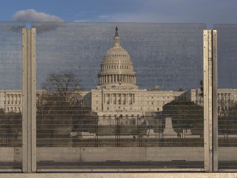 A section of fencing blocks the Capitol grounds at sunset on Monday. A section of fencing blocks the Capitol grounds at sunset on Monday.