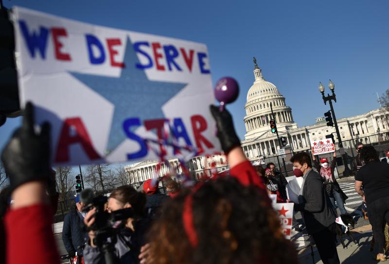 Activists take part in a March rally near the U.S. Capitol in support of statehood for Washington, D.C. One month later, the House of Representatives passed a bill 216-208 that would make D.C. the nation's 51st state. Activists take part in a March rally near the U.S. Capitol in support of statehood for Washington, D.C. One month later, the House of Representatives passed a bill 216-208 that would make D.C. the nation's 51st state.