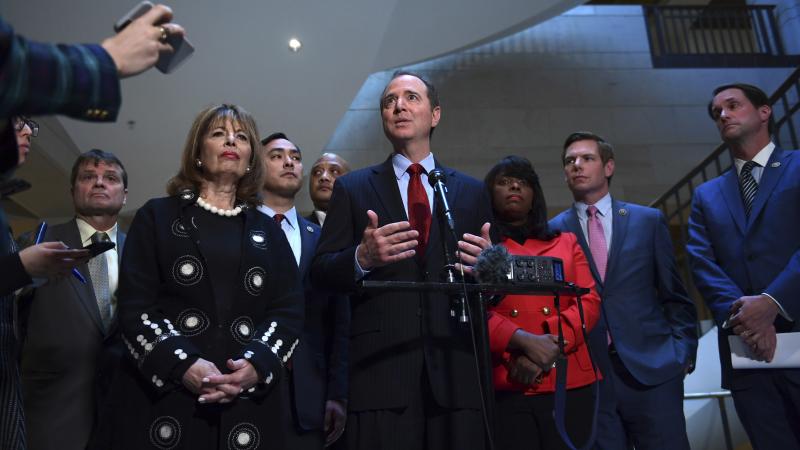 House intelligence committee ranking member Rep. Adam Schiff, D-Calif., speaks to reporters Tuesday on Capitol Hill, joined by other Democrats on the committee as they released a response to GOP conclusions on the House Russia investigation. House intelligence committee ranking member Rep. Adam Schiff, D-Calif., speaks to reporters Tuesday on Capitol Hill, joined by other Democrats on the committee as they released a response to GOP conclusions on the House Russia investigation.