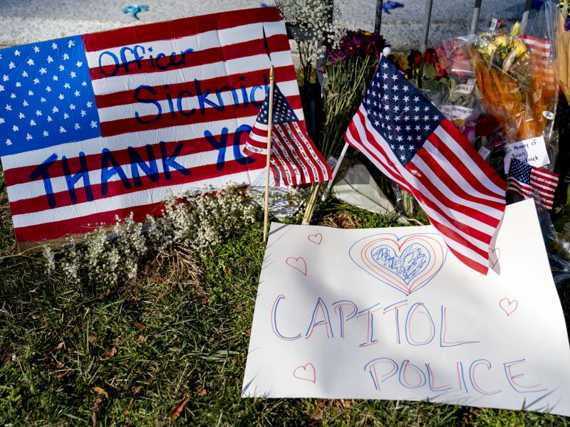 A memorial for U.S. Capitol Police Officer Brian Sicknick, who was killed by rioters in the Jan. 6 attack, is set up near the U.S. Capitol. A memorial for U.S. Capitol Police Officer Brian Sicknick, who was killed by rioters in the Jan. 6 attack, is set up near the U.S. Capitol.