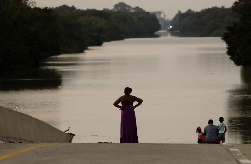 Filled to the brim by Hurricane Harvey's rainwaters, the Addicks and Barker reservoirs are finally empty once again. In this photo from Sept. 1, days after the hurricane first made landfall, a family looks at floodwaters in the Addicks Reservoir from a cl Filled to the brim by Hurricane Harvey's rainwaters, the Addicks and Barker reservoirs are finally empty once again. In this photo from Sept. 1, days after the hurricane first made landfall, a family looks at floodwaters in the Addicks Reservoir from a cl