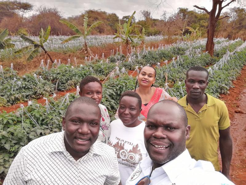 Noah Nasiali-Kadima, foreground, takes a selfie with members of the Africa Farmers Group during a tour of a member's farm in Machakos County, Kenya. Noah Nasiali-Kadima, foreground, takes a selfie with members of the Africa Farmers Group during a tour of a member's farm in Machakos County, Kenya.
