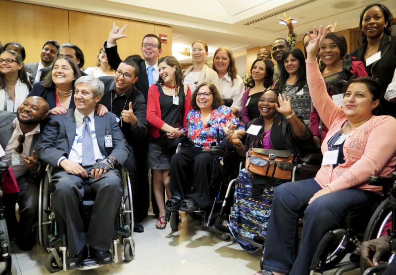At the State Department conference for people with disabilities, adviser Judy Heumann (center) is surrounded by admirers from around the world. At the State Department conference for people with disabilities, adviser Judy Heumann (center) is surrounded by admirers from around the world.