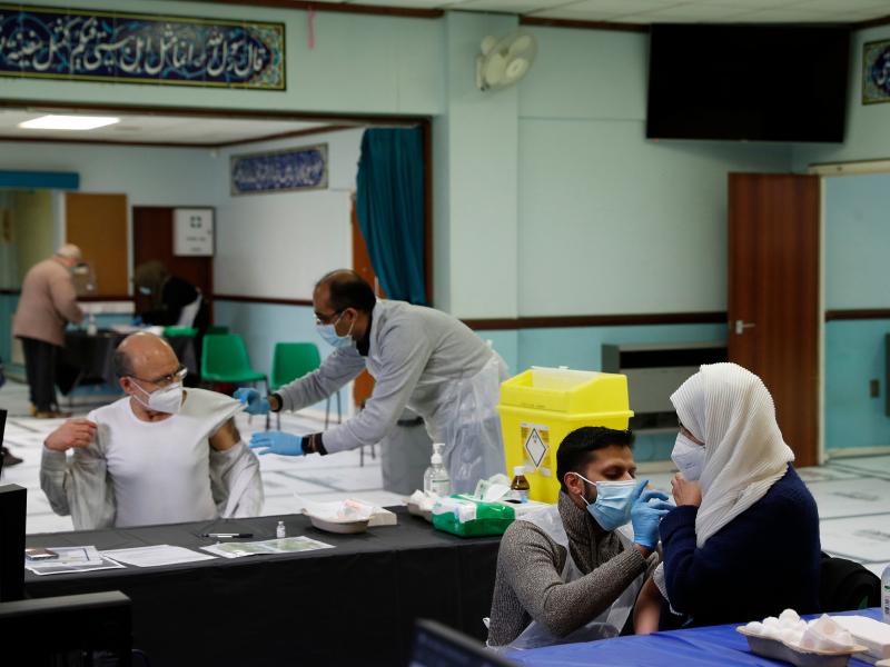 People receive the AstraZeneca COVID-19 vaccine at the Al-Abbas Islamic Center, converted into a vaccination clinic in Birmingham, England, in January. Sheikh Nuru Mohammed, the imam at the mosque, recognized many of his congregants were hesitant to get t People receive the AstraZeneca COVID-19 vaccine at the Al-Abbas Islamic Center, converted into a vaccination clinic in Birmingham, England, in January. Sheikh Nuru Mohammed, the imam at the mosque, recognized many of his congregants were hesitant to get t
