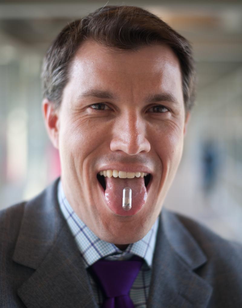 Chris Bettinger poses for a portrait with the edible battery his team designed at Carnegie Mellon University. Chris Bettinger poses for a portrait with the edible battery his team designed at Carnegie Mellon University.