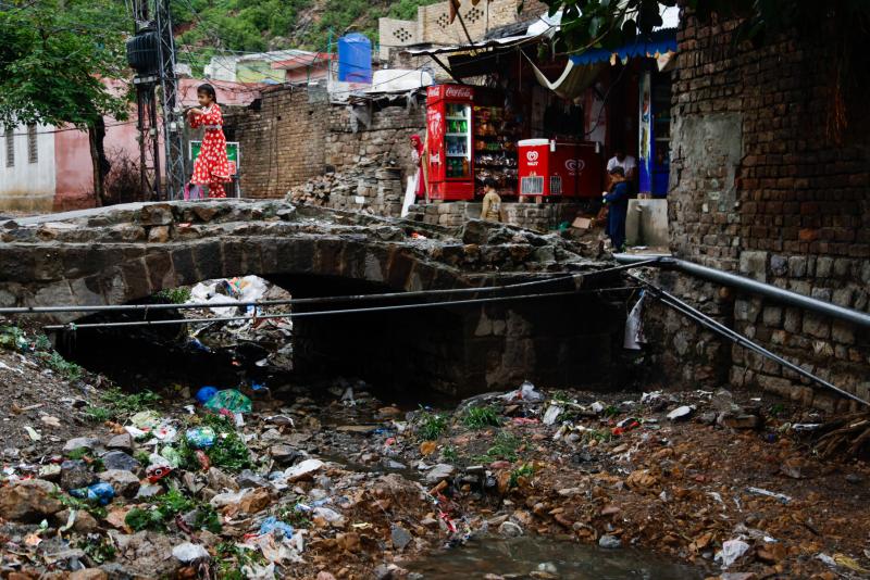 The river that once snaked through the village is now a large trash heap. The river that once snaked through the village is now a large trash heap.