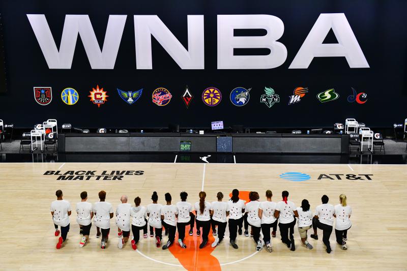 After the WNBA announcement of the postponed games for the evening, the Washington Mystics each wear white T-shirts with seven bullets on the back protesting the shooting of Jacob Blake by Kenosha, Wisconsin police at Feld Entertainment Center on August 2 After the WNBA announcement of the postponed games for the evening, the Washington Mystics each wear white T-shirts with seven bullets on the back protesting the shooting of Jacob Blake by Kenosha, Wisconsin police at Feld Entertainment Center on August 2