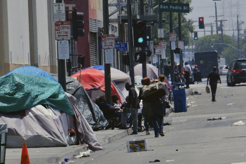 Tents housing homeless line a street down the street from LAPD Central Community Police Station in downtown Los Angeles on May 30, 2019. In this city, homeless encampments are sprouting up in underpasses, along streets and on sidewalks and inside parks. Tents housing homeless line a street down the street from LAPD Central Community Police Station in downtown Los Angeles on May 30, 2019. In this city, homeless encampments are sprouting up in underpasses, along streets and on sidewalks and inside parks.