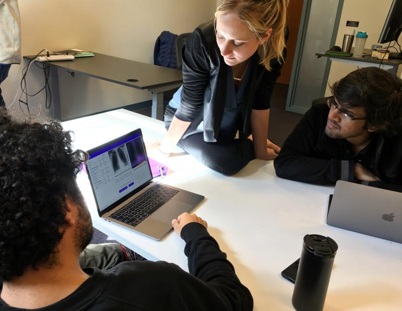 Amir Kiani (from left), Chloe O'Connell and Nishit Asnani troubleshoot an algorithm to diagnose tuberculosis in computer lab at Stanford University. Amir Kiani (from left), Chloe O'Connell and Nishit Asnani troubleshoot an algorithm to diagnose tuberculosis in computer lab at Stanford University.