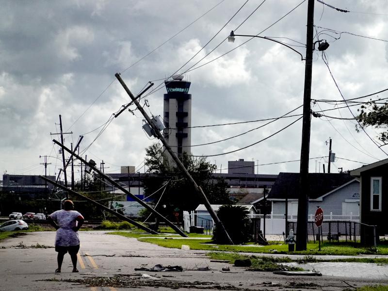 A woman surveys damage Monday from Hurricane Ida in a neighborhood in Kenner, La. The storm was fueled by abnormally warm water in the Gulf of Mexico. A woman surveys damage Monday from Hurricane Ida in a neighborhood in Kenner, La. The storm was fueled by abnormally warm water in the Gulf of Mexico.