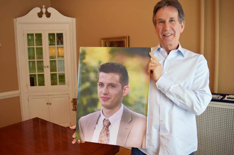 Dr. James Baker holds a photo of his son, Max, who had been sober for more than a year and was in college when he relapsed after surgery and died of a heroin overdose. Dr. James Baker holds a photo of his son, Max, who had been sober for more than a year and was in college when he relapsed after surgery and died of a heroin overdose.