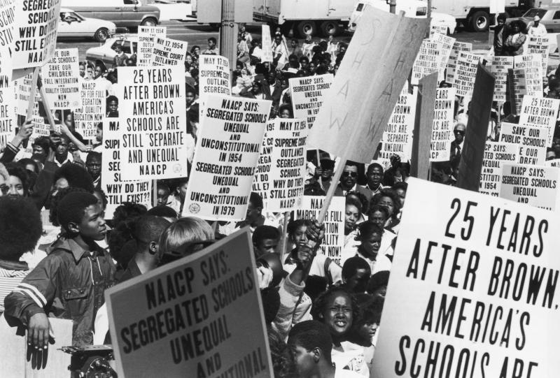 Students and members of the NAACP march in Washington in May 1979, the 25th anniversary of the U.S. Supreme Court's ruling which ended racial segregation in American schools. Students and members of the NAACP march in Washington in May 1979, the 25th anniversary of the U.S. Supreme Court's ruling which ended racial segregation in American schools.