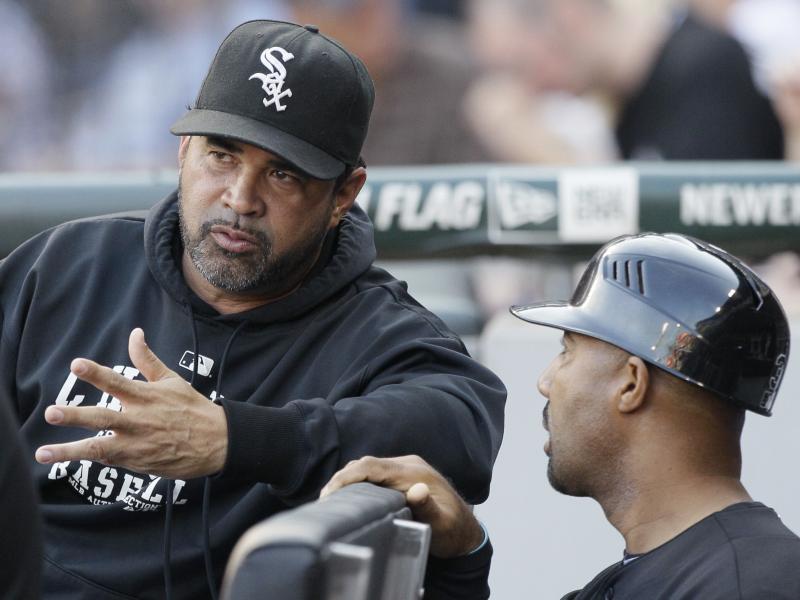 Chicago White Sox manager Ozzie Guillen, left, talks with first base coach Harold Baines in the dugout during a game in 2011. Chicago White Sox manager Ozzie Guillen, left, talks with first base coach Harold Baines in the dugout during a game in 2011.