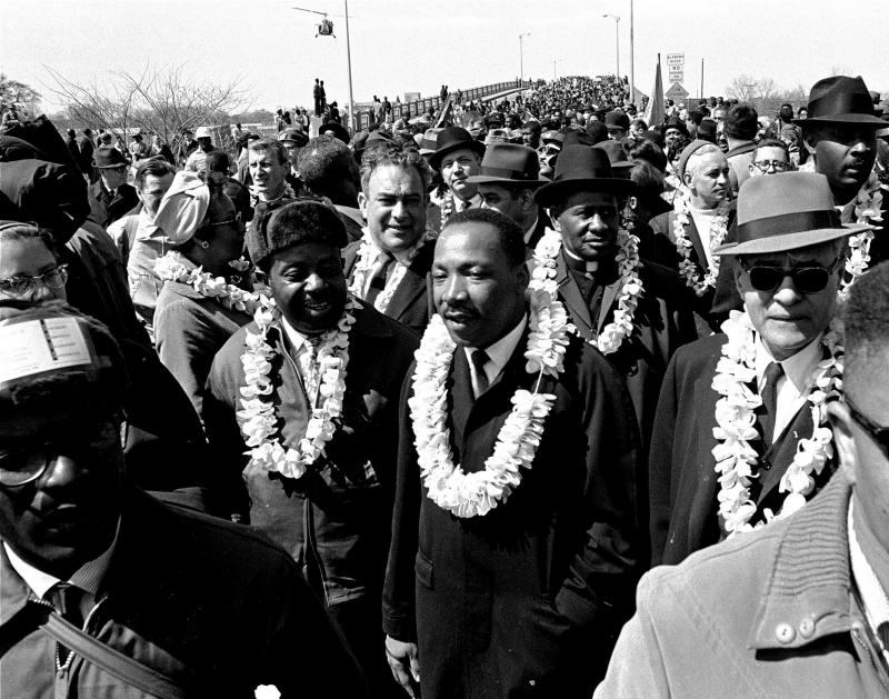 The nonviolent actions of Dr. King inspired young Kennedy Odede. In this March 21, 1965 file photo, King leads a civil rights march across the Edmund Pettus Bridge in Selma, Ala., to protest voting laws. The nonviolent actions of Dr. King inspired young Kennedy Odede. In this March 21, 1965 file photo, King leads a civil rights march across the Edmund Pettus Bridge in Selma, Ala., to protest voting laws.