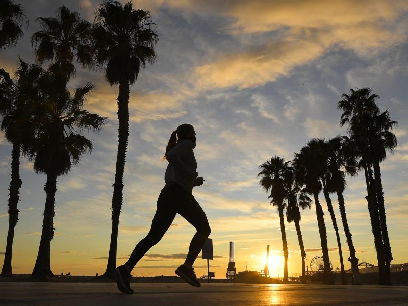 A jogger runs on Santa Monica State Beach on April 10 in Santa Monica, Calif. Running is one form of exercise that meets social distancing guidelines. A jogger runs on Santa Monica State Beach on April 10 in Santa Monica, Calif. Running is one form of exercise that meets social distancing guidelines.