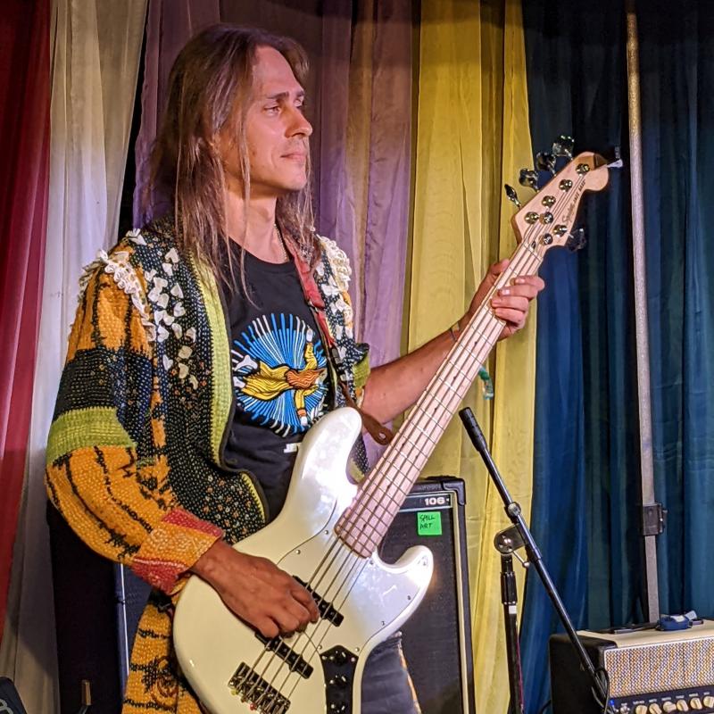 Bass player Vitaly Prismototrov at the JetLAG Festival. This was not Prismotrov's first visit to the U.S. In 2008 he performed with Dolly Parton's band in Tennessee. Bass player Vitaly Prismototrov at the JetLAG Festival. This was not Prismotrov's first visit to the U.S. In 2008 he performed with Dolly Parton's band in Tennessee.