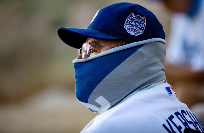 A fan wears a neck gaiter as he watches the Los Angeles Dodgers play at home against the San Francisco Giants last week. A fan wears a neck gaiter as he watches the Los Angeles Dodgers play at home against the San Francisco Giants last week.