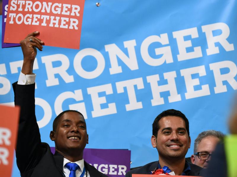 Delegates hold up signs with the Clinton campaign slogan during last month's Democratic National Convention in Philadelphia. Delegates hold up signs with the Clinton campaign slogan during last month's Democratic National Convention in Philadelphia.