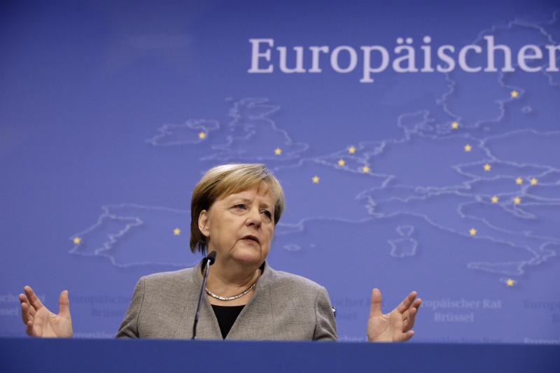 German Chancellor Angela Merkel speaks during a news conference at the conclusion of a European Union summit in Brussels, Dec. 13. German Chancellor Angela Merkel speaks during a news conference at the conclusion of a European Union summit in Brussels, Dec. 13.