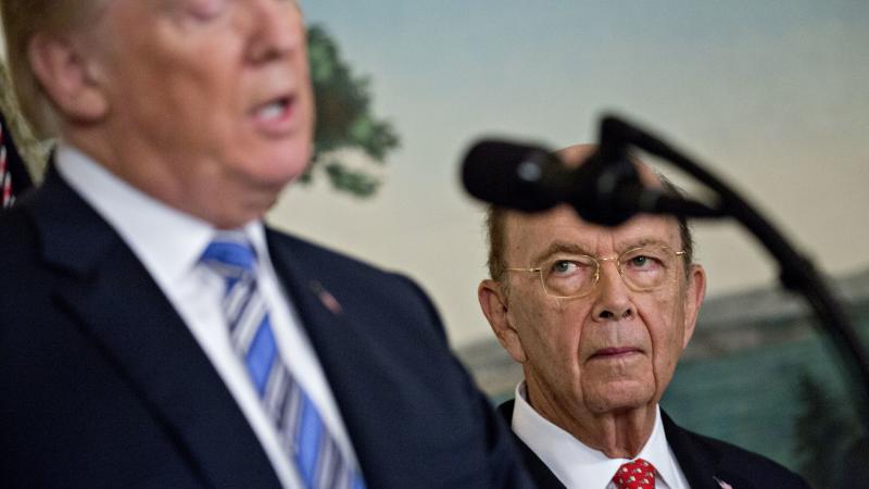 Commerce Secretary Wilbur Ross listens to President Trump at the White House in March. Ross' decision to add a question about U.S. citizenship status to the 2020 census sparked six lawsuits from dozens of states, cities and other groups that want the ques Commerce Secretary Wilbur Ross listens to President Trump at the White House in March. Ross' decision to add a question about U.S. citizenship status to the 2020 census sparked six lawsuits from dozens of states, cities and other groups that want the ques