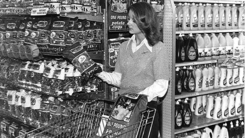A woman shopping in the 1970s picks up a bag of Snyder's pretzels. Today, Hanover remains a center of snack food manufacturing, even as the food industry changes around it. A woman shopping in the 1970s picks up a bag of Snyder's pretzels. Today, Hanover remains a center of snack food manufacturing, even as the food industry changes around it.