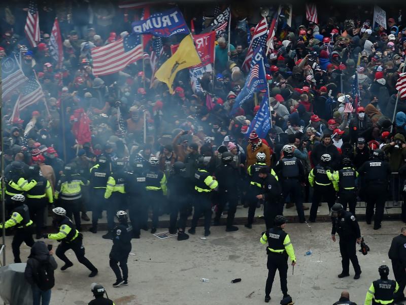 Police hold back supporters of Donald Trump as they gather outside the U.S. Capitol on January 6, 2021, in Washington, DC. Police hold back supporters of Donald Trump as they gather outside the U.S. Capitol on January 6, 2021, in Washington, DC.